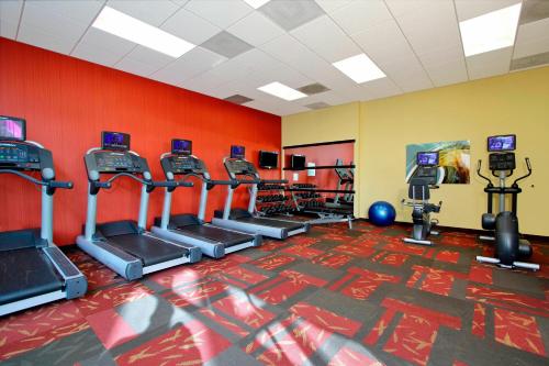 a gym with rows of treadmills and machines at Courtyard Oakland Downtown in Oakland