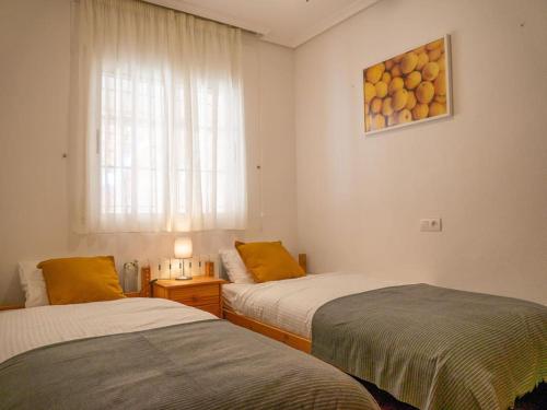 Postel nebo postele na pokoji v ubytování Casa junto al Mar Menor