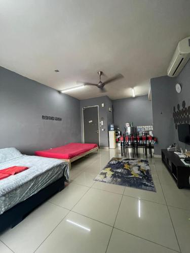 a bedroom with a bed and a table and chairs at Urban 360 Studio Love Rara Suite Homestay in Batu Caves