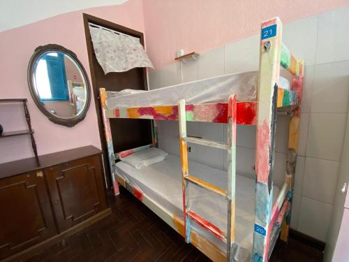 a bunk bed in a room with a mirror at Zili Pernambuco - Hostel Pousada in Recife