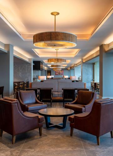 a waiting room with chairs and a table at Radisson Blu Hotel, Conakry in Conakry