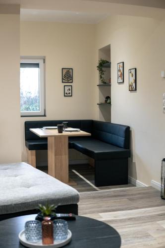 a living room with a couch and a table at Ferienhaus Wesseling in Wesseling