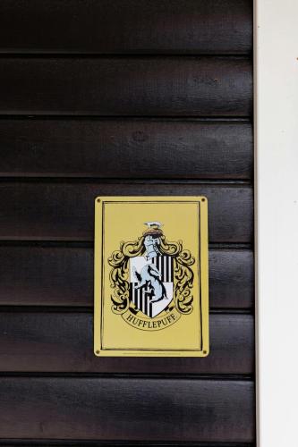 a yellow sign on the side of a building at Architect-Designed Home With Outdoor Space in Hundested