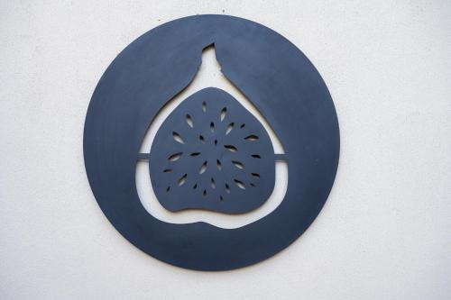 a blue and white sign with a picture of a leaf at Khiwane Boutique Hotel in Hoedspruit