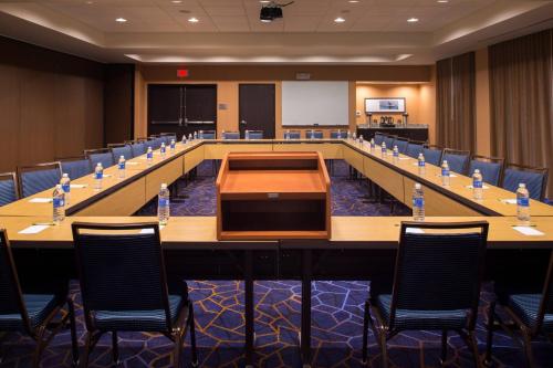 a large conference room with a long table and chairs at Courtyard by Marriott Hot Springs in Hot Springs