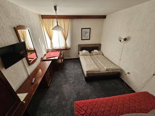 Postel nebo postele na pokoji v ubytování ApartHotel Kopaonik