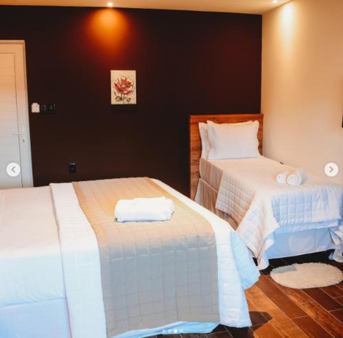 Una cama o camas en una habitación de Flores da Praça