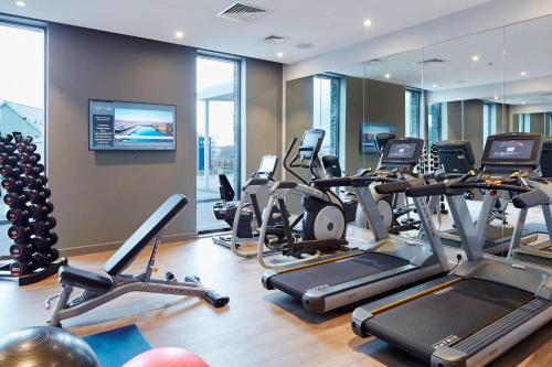 a gym with treadmills and elliptical machines at Courtyard by Marriott Oxford South in Abingdon