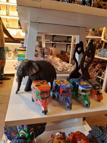 a shelf with figurines of an elephant and a train at RKO Villa27 - Unawatuna in Habaraduwa