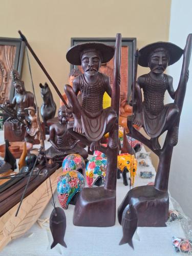 a group of statues sitting on top of a table at RKO Villa27 - Unawatuna in Habaraduwa