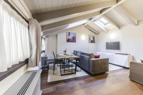 a living room with a table and a couch at Luxury Apartment Venice in Venice