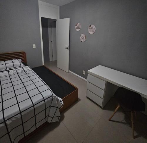 Postel nebo postele na pokoji v ubytování Minha Praia