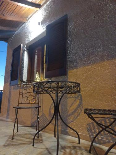 a television sitting on a table in front of a building at Vagia in Tríkala