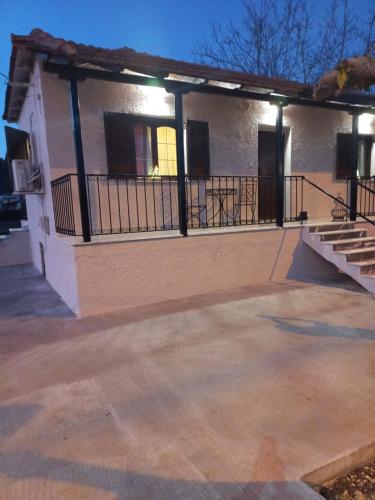 an empty parking lot in front of a building at Vagia in Tríkala