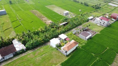 an aerial view of a house in a field at Sumbul View Surfcamp in Airsatang