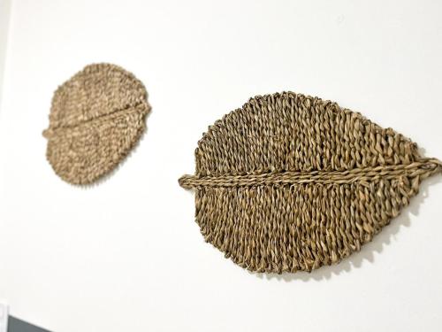 a brown hat on a white background at I-17 um Studio aconchegante in Maceió