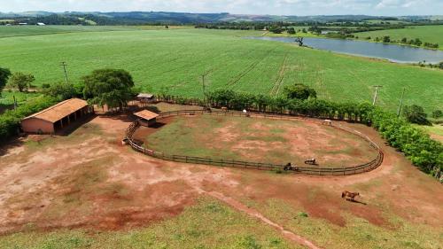 an aerial view of a farm with a horse track at Hotel Berro D`Agua Eco Resort in Avaré