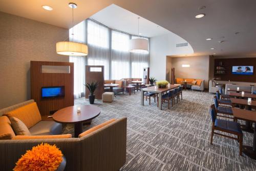 a lobby with couches and tables and a waiting room at Courtyard by Marriott Canton in North Canton