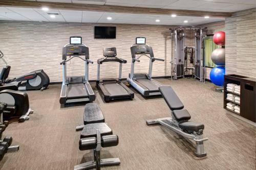 a gym with several cardio equipment in a room at Courtyard by Marriott Columbia Northeast/Fort Jackson Area in Columbia