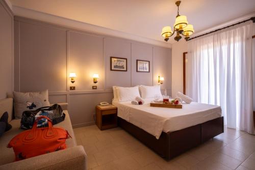 Ένα ή περισσότερα κρεβάτια σε δωμάτιο στο Hotel Capanna d'Oro Dependance