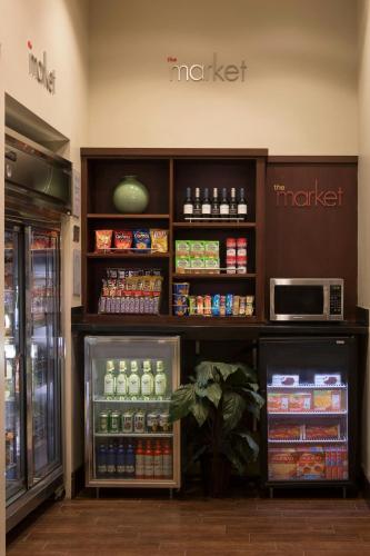 a store with a refrigerator filled with lots of drinks at Courtyard by Marriott Boynton Beach in Boynton Beach