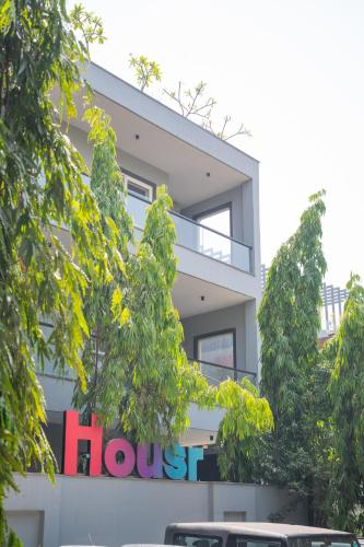 a building with a house sign in front of it at Housr Phase 1 Arjun Marg & Golf Course Road in Gurgaon