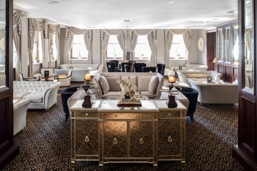 a large living room with couches and a table at The Vermont Hotel & Vermont Aparthotel in Newcastle upon Tyne
