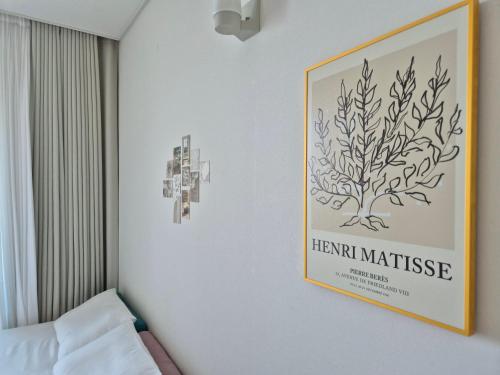 a picture of a plant on a wall at Cozy room Oceanview Memory Yeongjong in Incheon