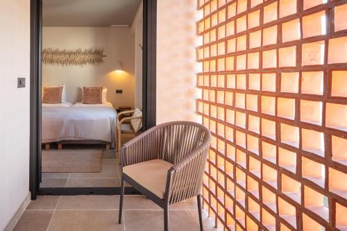 En eller flere senge i et værelse på Puerto Marina