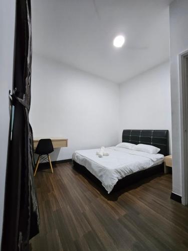 Ένα ή περισσότερα κρεβάτια σε δωμάτιο στο The Pineapple Homestay