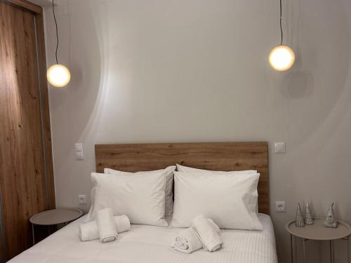 a bedroom with a bed with two towels on it at Abete Luxury Apartments in Metsovo
