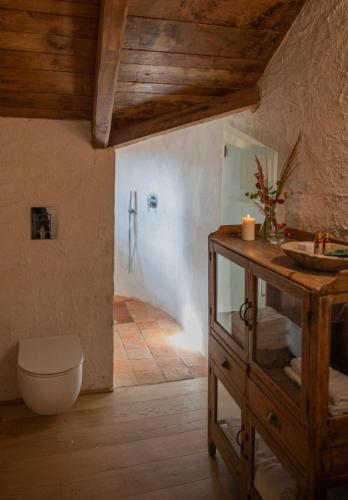 a bathroom with a sink and a toilet in a room at Castello di Rocca Cilento in Rocca Cilento