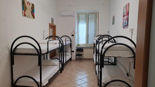 Postel nebo postele na pokoji v ubytování Atlantic Ostello B&B