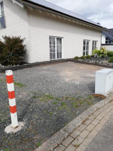 a parking lot in front of a house at Ferienwohnung Röddenau in Röddenau