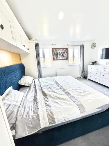 a bedroom with a large bed in a room at Rose home in Haverhill