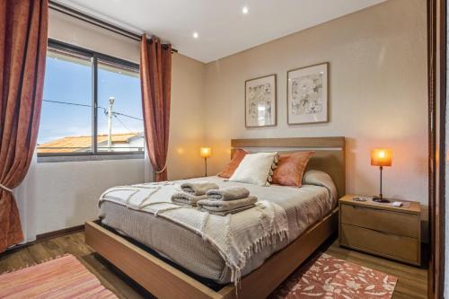 Postel nebo postele na pokoji v ubytování Cozy Apartments by Homie