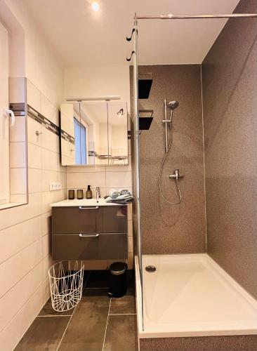 a bathroom with a shower and a sink at Casa Cara in Liebenburg