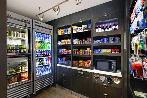 a refrigerator filled with lots of food and drinks at Courtyard Chicago Elmhurst/Oakbrook Area in Elmhurst