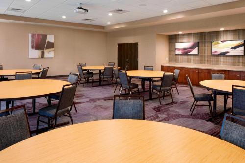 a conference room with tables and chairs in it at Courtyard by Marriott Houston Intercontinental Airport in Houston