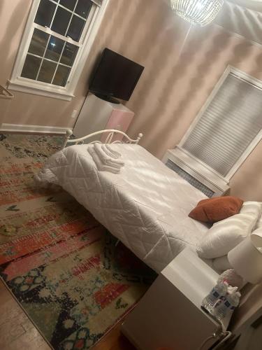 Postel nebo postele na pokoji v ubytování Cocoa Breeze Nook Suite