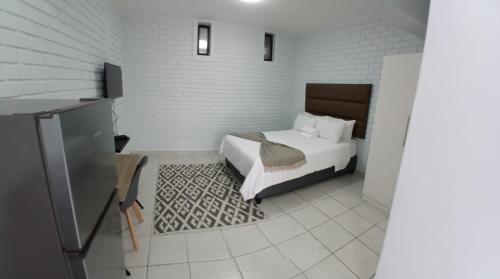 a bedroom with a bed in a room at Grace Villas 25 in East London