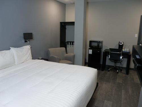 Ένα ή περισσότερα κρεβάτια σε δωμάτιο στο Motel Hotelia