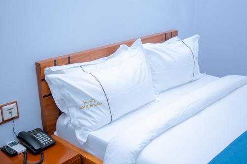 Ein Bett oder Betten in einem Zimmer der Unterkunft Hotel Rolax