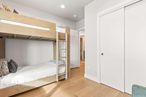 a bedroom with two bunk beds and a closet at Luxury Lakeview Retreat A Jordanelle Gem in Hideout, Utah in Keetley