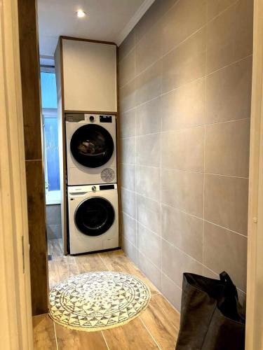 a washer and dryer in a small room at Central and modern in Oslo