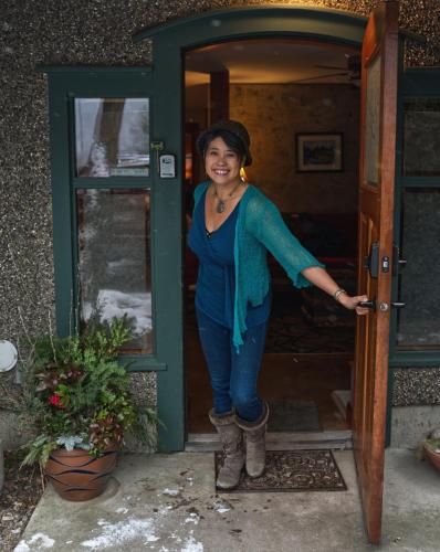 a woman standing in the doorway of a door at Mistiso's Place Vacation Rentals in Nelson
