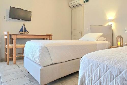 Postel nebo postele na pokoji v ubytování Lefkas Apt