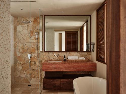 a bathroom with a sink and a mirror at 大理空岛半山海景民宿 in Dali