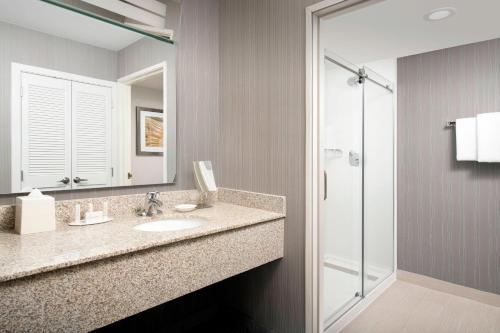 a bathroom with a sink and a shower at Courtyard by Marriott Portland Hillsboro in Hillsboro
