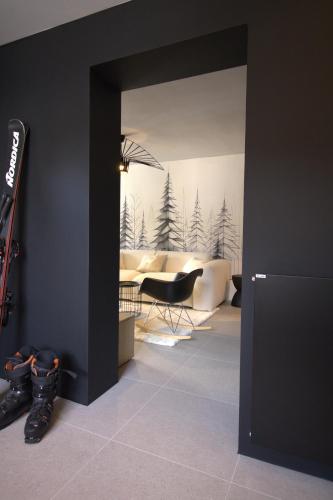 a room with a couch and a chair in a room at Appartement ski in-out 4-6 pers Les Crosets Porte du Soleil in Les Crosets